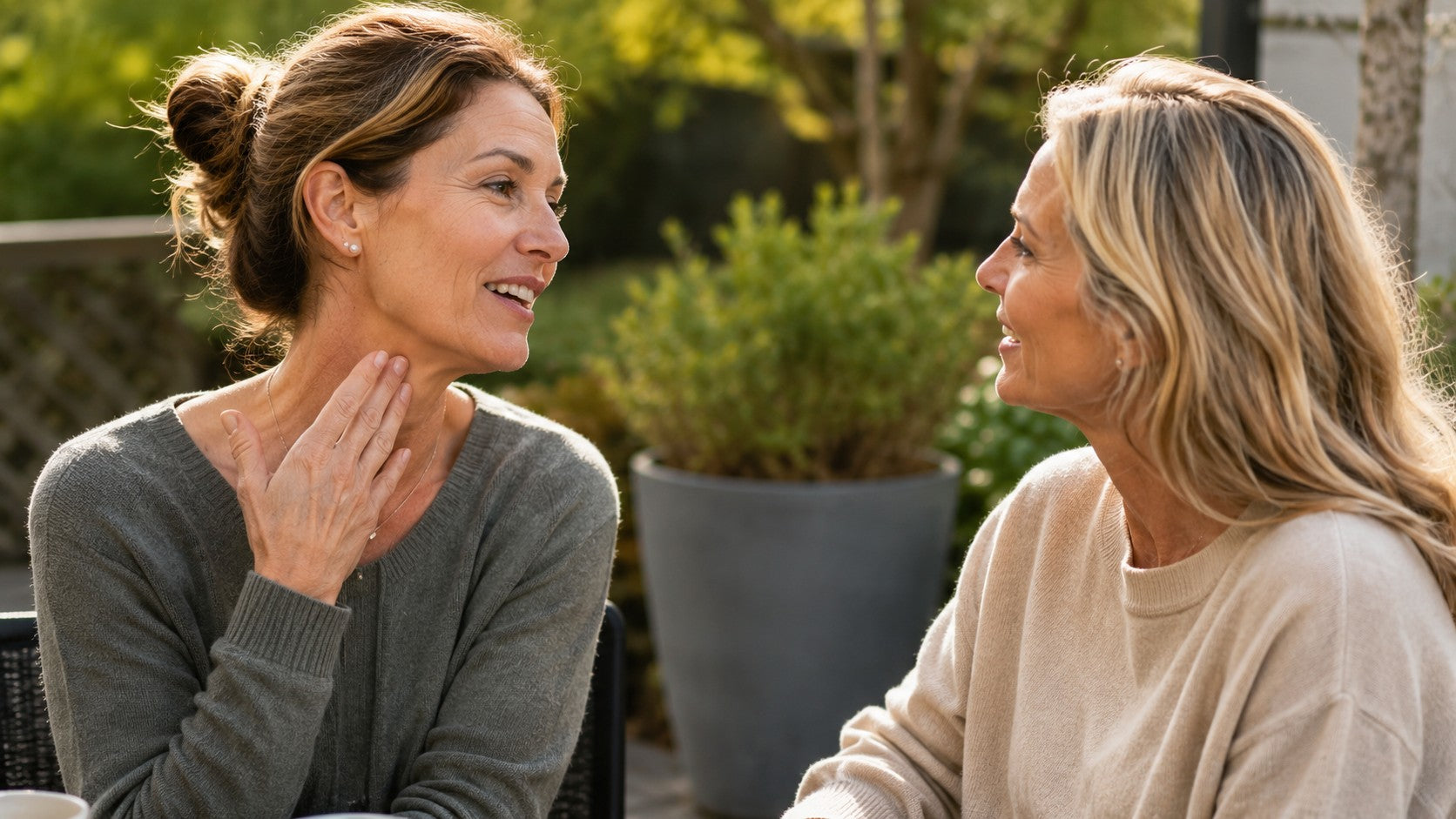Two women smiling, discussing their skincare results